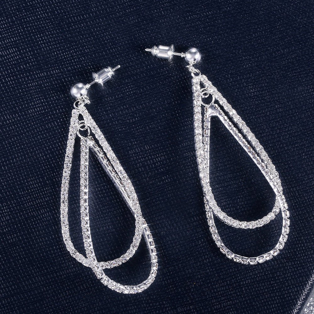 Courbe - Teardrop Shaped Chain Tassel Earrings